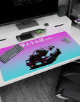 40x20 inches anime desk pad featuring AE86 front view, pop-up headlights glowing under neon dusk.