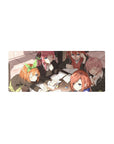28x12 inches anime girl mouse pad with five schoolgirls in black blazers, notebooks and pastel pens.