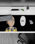 36x16 inches desk pad in bold black and yellow, clean lines and deadpan OK bubble, calm funny vibe.