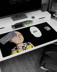Saitama staring ahead with cape clasped, OK bubble punchline on black anime desk pad, 40x20 inches.