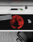 Moody red-to-black anime desk pad 36x16 inches, dark fantasy vibe with smoky shadows and stark contrast.