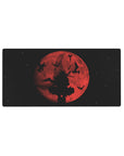Crimson moon anime mouse pad 32x16 inches with silhouetted swordsman and ink-like birds over stars.
