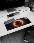 Tiny burning star scene mouse pad 28x12 inches surrounded by curling amber clouds and faint lights.