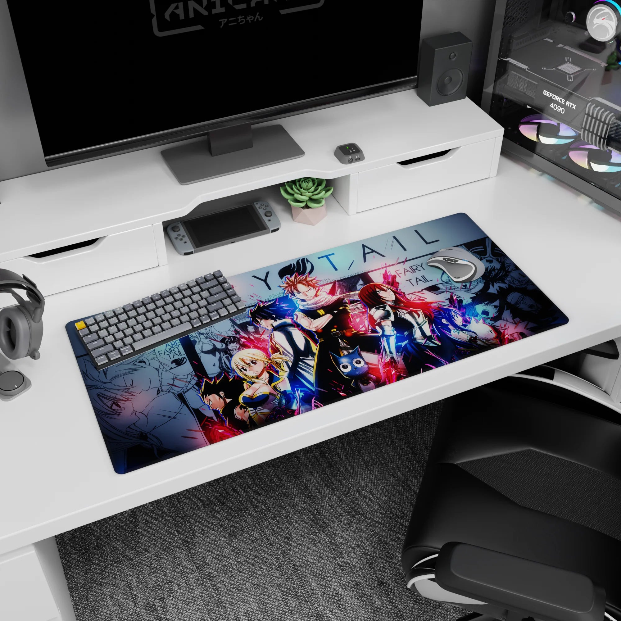 Natsu front and center with scarf, Lucy and Gray beside him on Fairy Tail desk pad 36x16 inches.