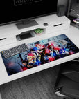Natsu front and center with scarf, Lucy and Gray beside him on Fairy Tail desk pad 36x16 inches.