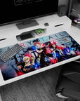 Natsu in his scarf front and center on a Fairy Tail anime desk pad 40x20 inches, with Lucy and Gray.