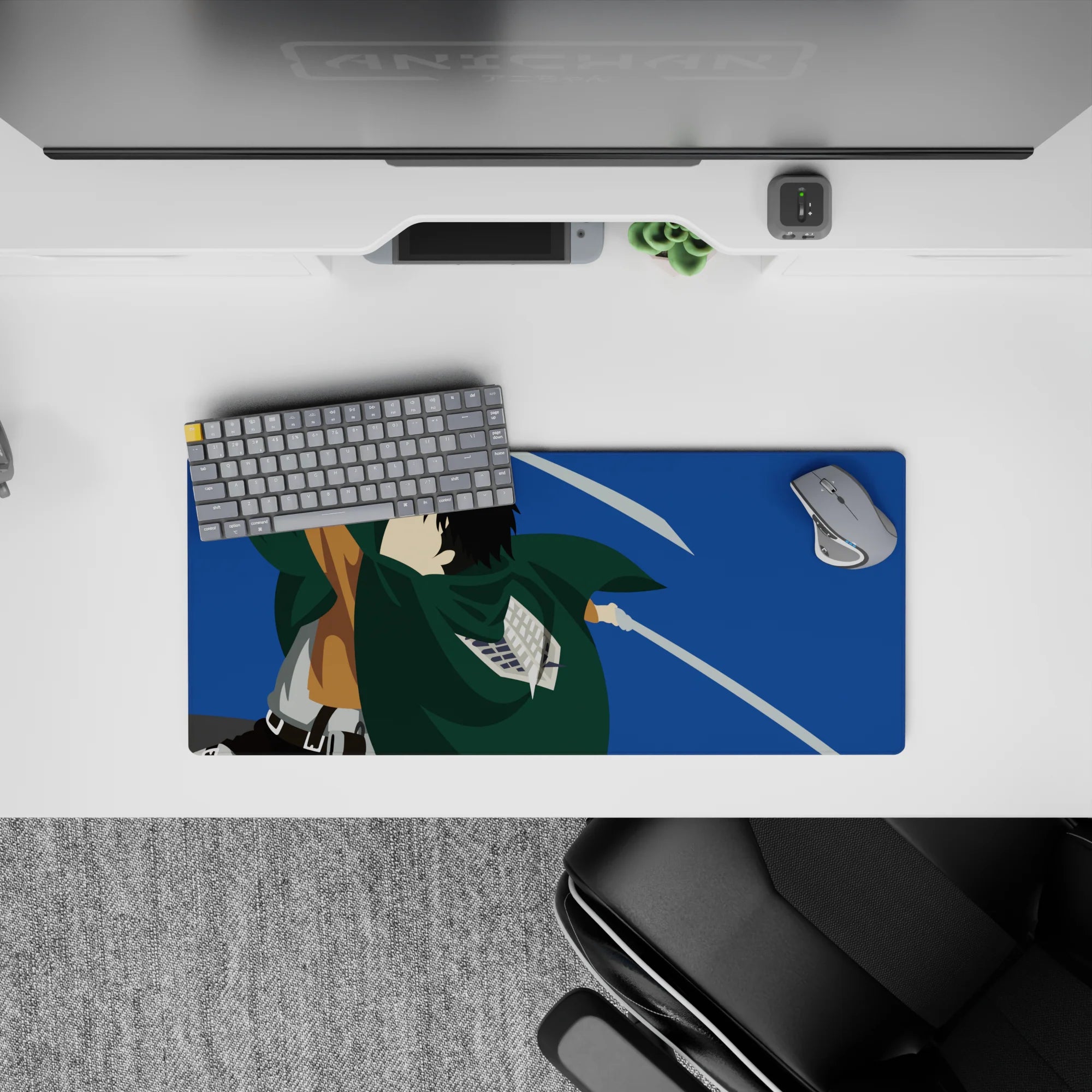 Mouse pad 28x12 inches with a stylized silhouette of a Scout Regiment soldier from Attack on Titan, blades drawn mid-air.