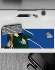 Anime mouse pad 32x12 inches featuring Scout Regiment soldier from Attack on Titan, blades drawn mid-air against blue sky.