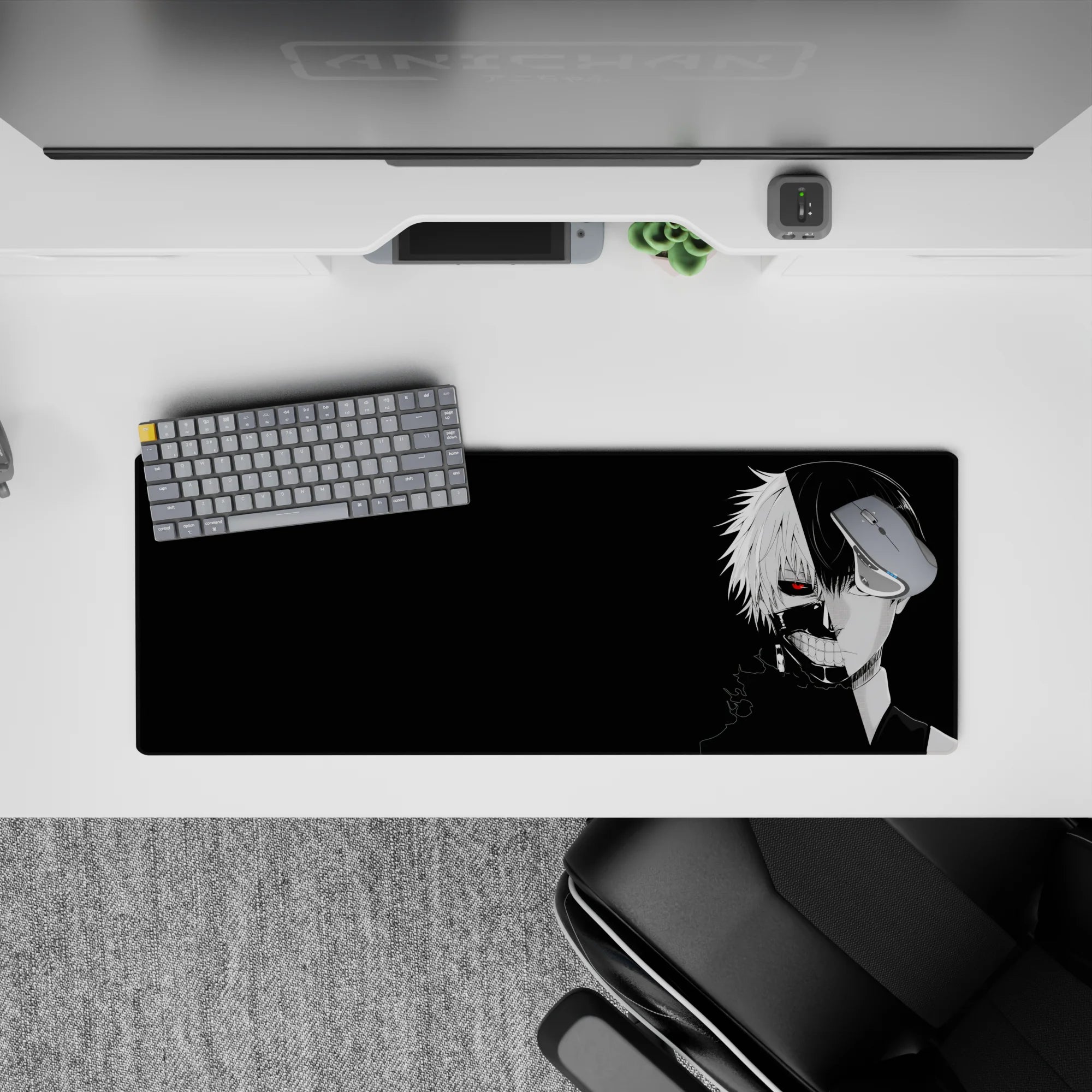 Kaneki split face Tokyo Ghoul anime mouse pad 32x12 inches with red eye and black background for dramatic effect.