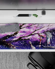 36x16 inches purple night desk pad in lilac clouds, black branches, and sparkling white sakura flakes.
