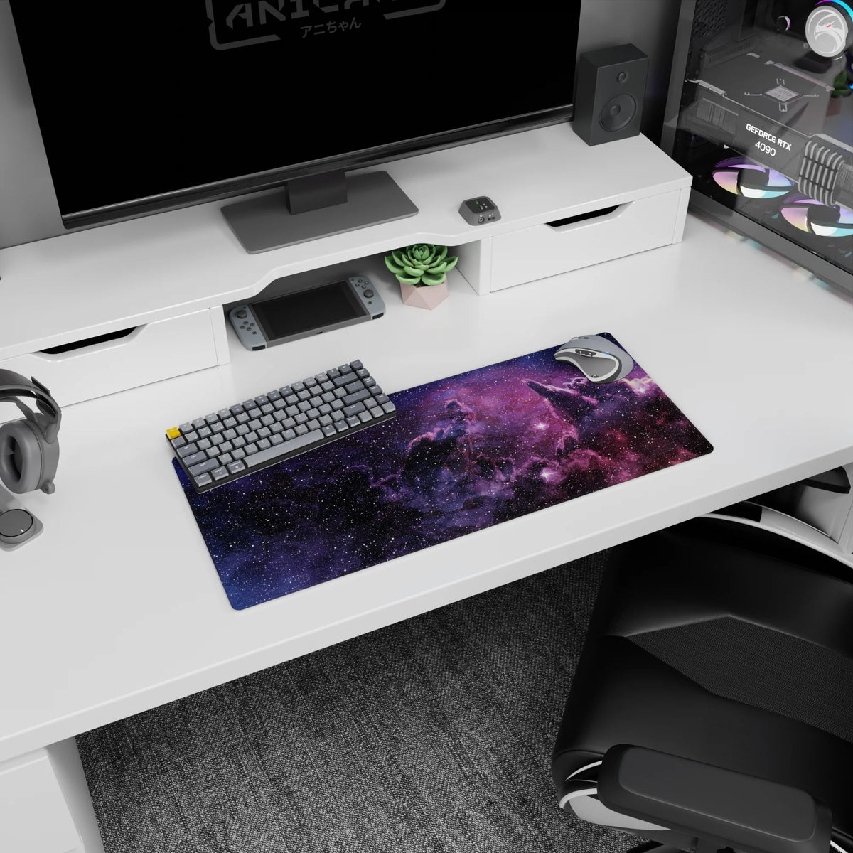 28x12 inches mouse pad showing a dreamy galaxy scene with sprinkled stars over soft purple clouds.