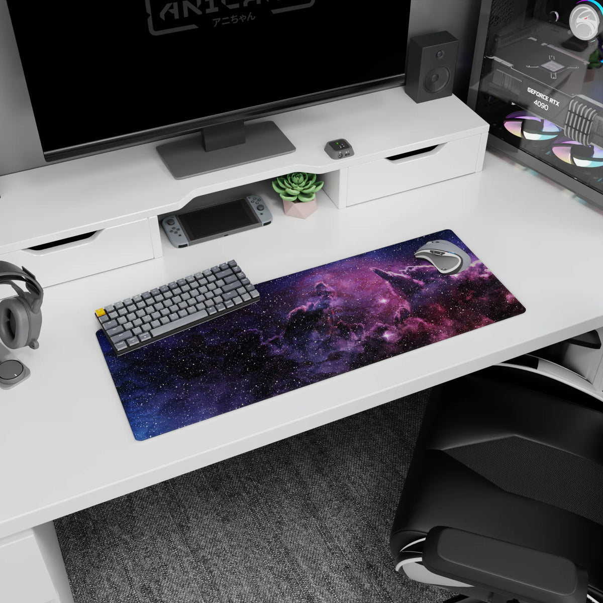 Space scene mouse pad with sprinkled stars and soft rosy glow, 32x12 inches.