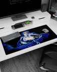 Anime girl desk pad 36x16 inches featuring a blonde cloaked heroine pose with glossy neon highlights.