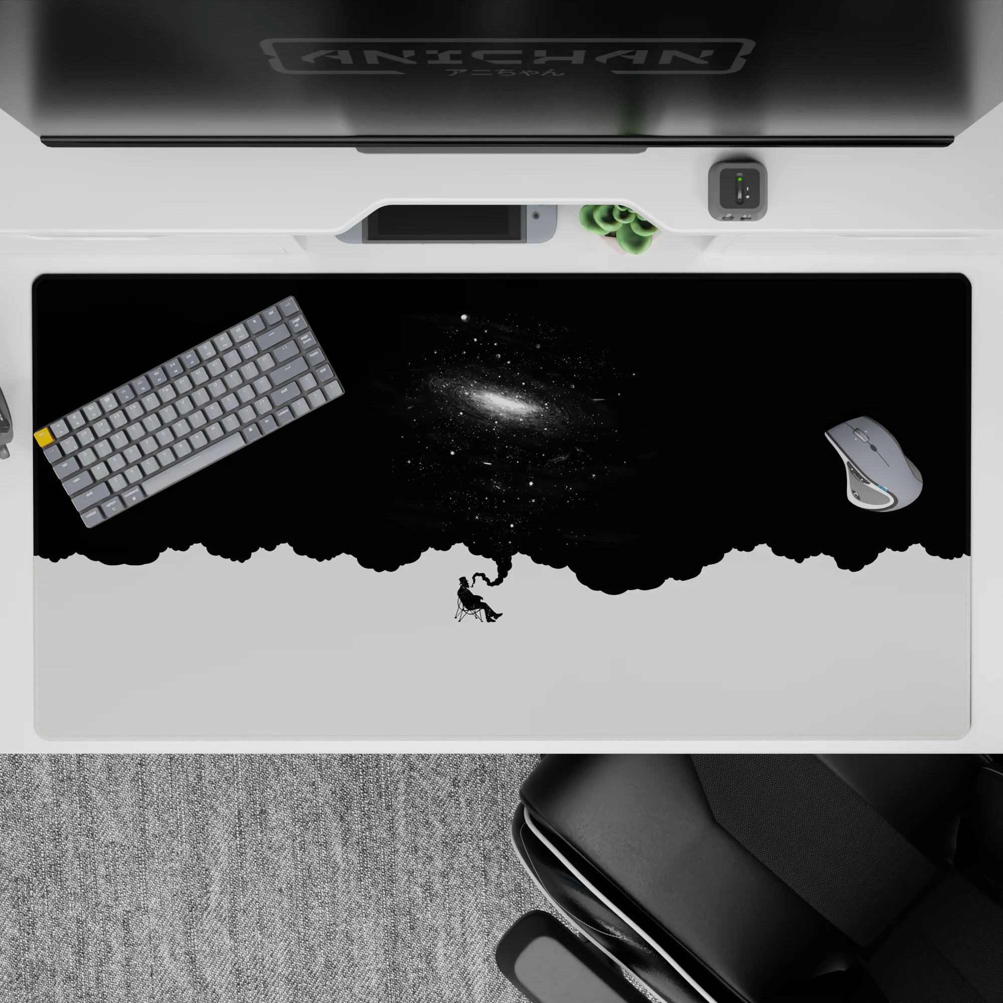 Moody black-and-white desk pad 40x20 inches with deep night sky, tiny stars, and soft galaxy glow.