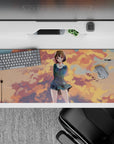 Cozy pastel anime desk pad 36x16 inches in peach and gold sunset tones with cool blue sky trails.