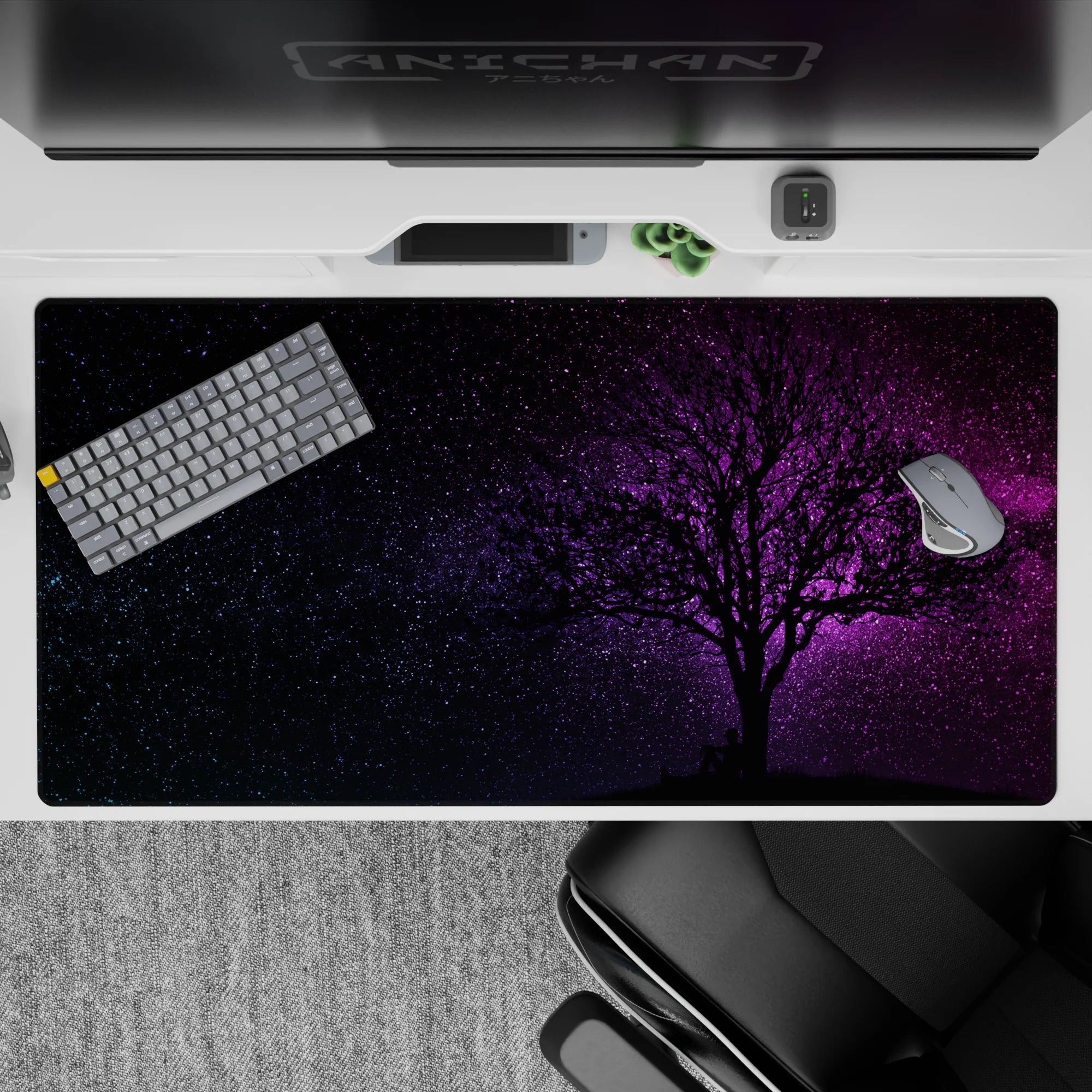 Moody 40x20 inches desk pad in deep black fading to violet and magenta, calming dreamy galaxy feel.
