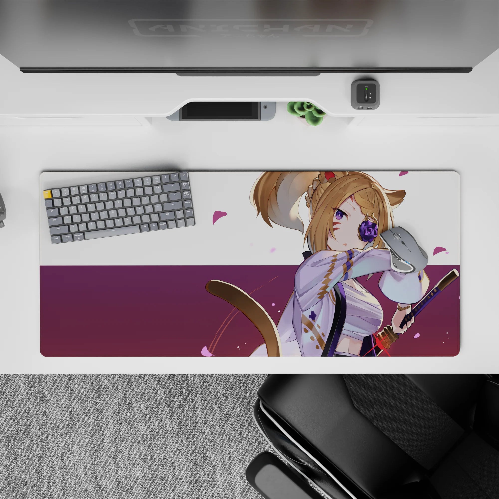 Cozy bold anime desk pad in lavender, violet, and deep plum with floating pink petals, 36x16 inches.