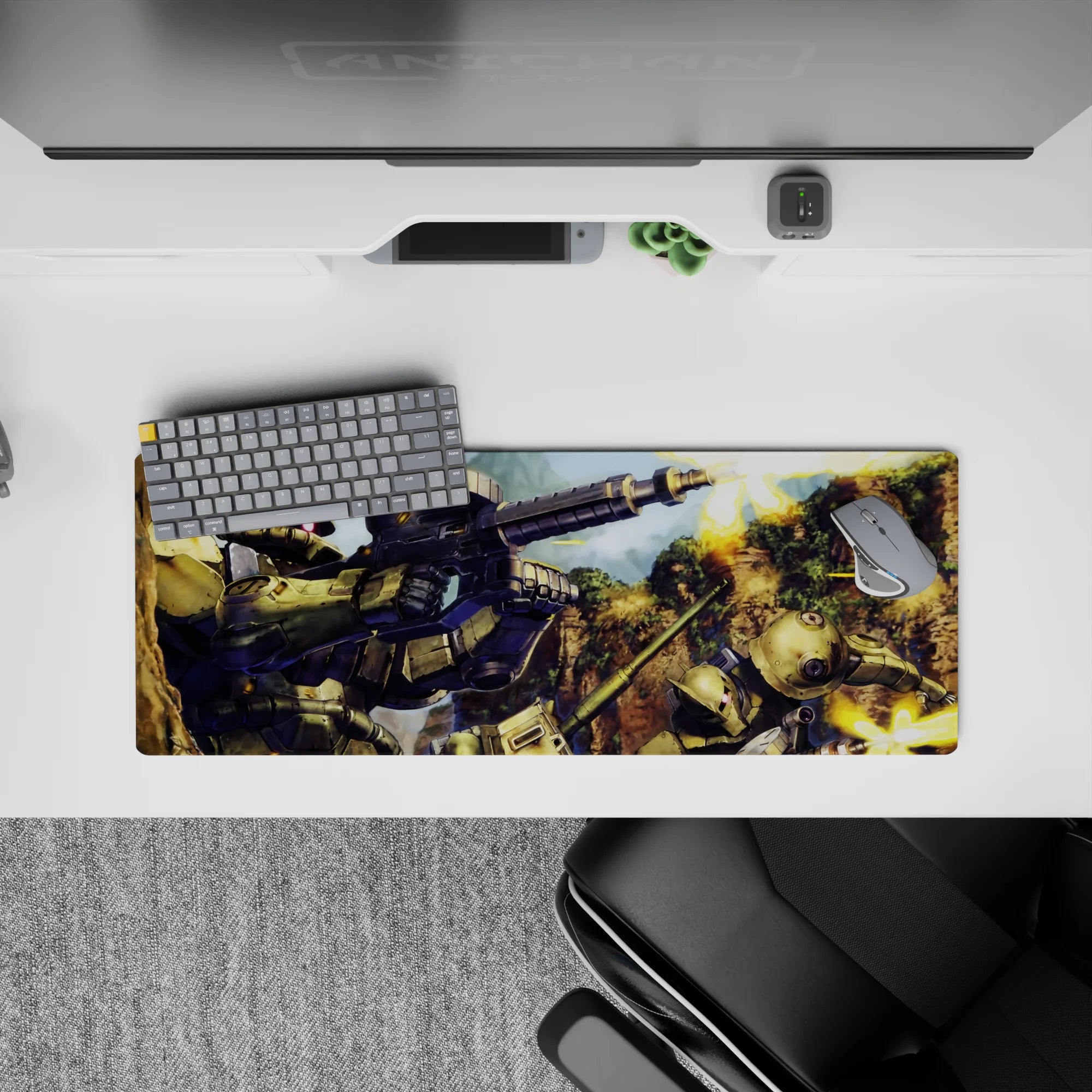 32x12 inches anime mouse pad in olive green armor tones with pink mono-eye glow and bright muzzle flashes.