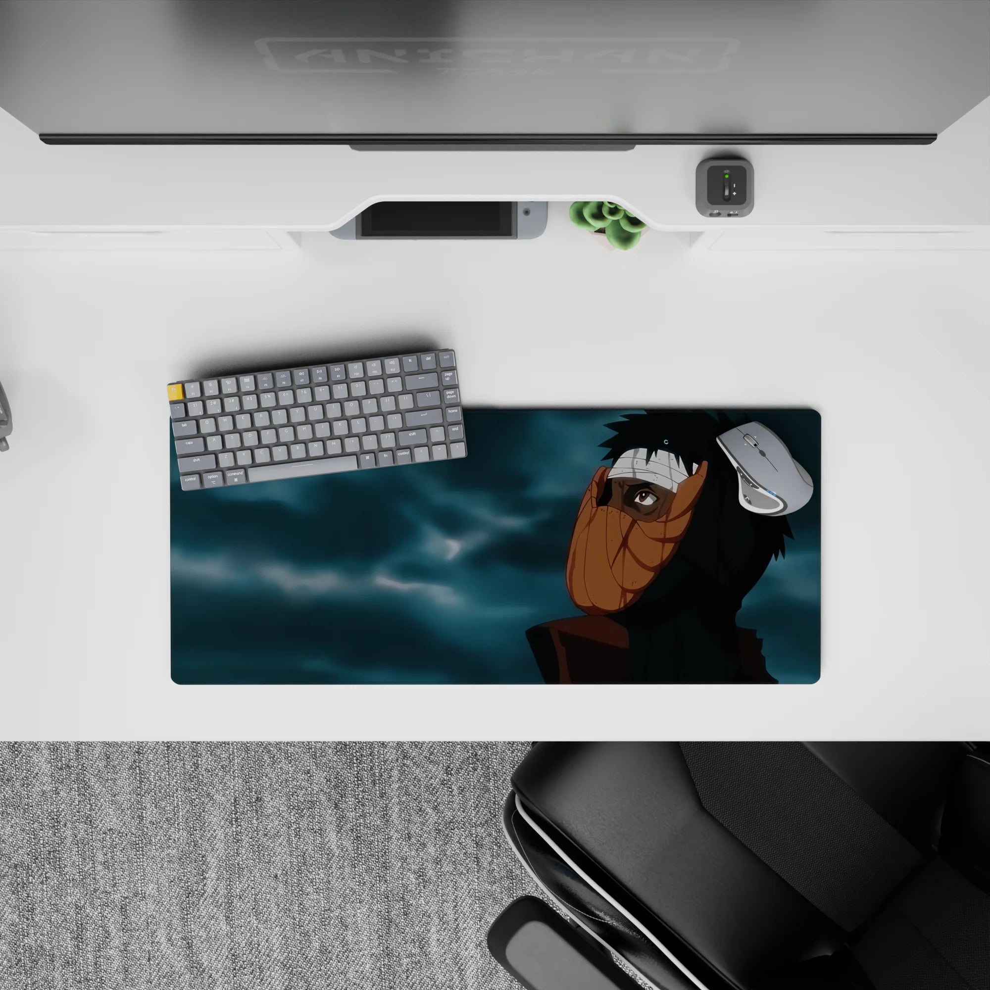 28x12 inches anime mouse pad in dark black tones with warm orange mask highlights and moody blue-gray clouds.