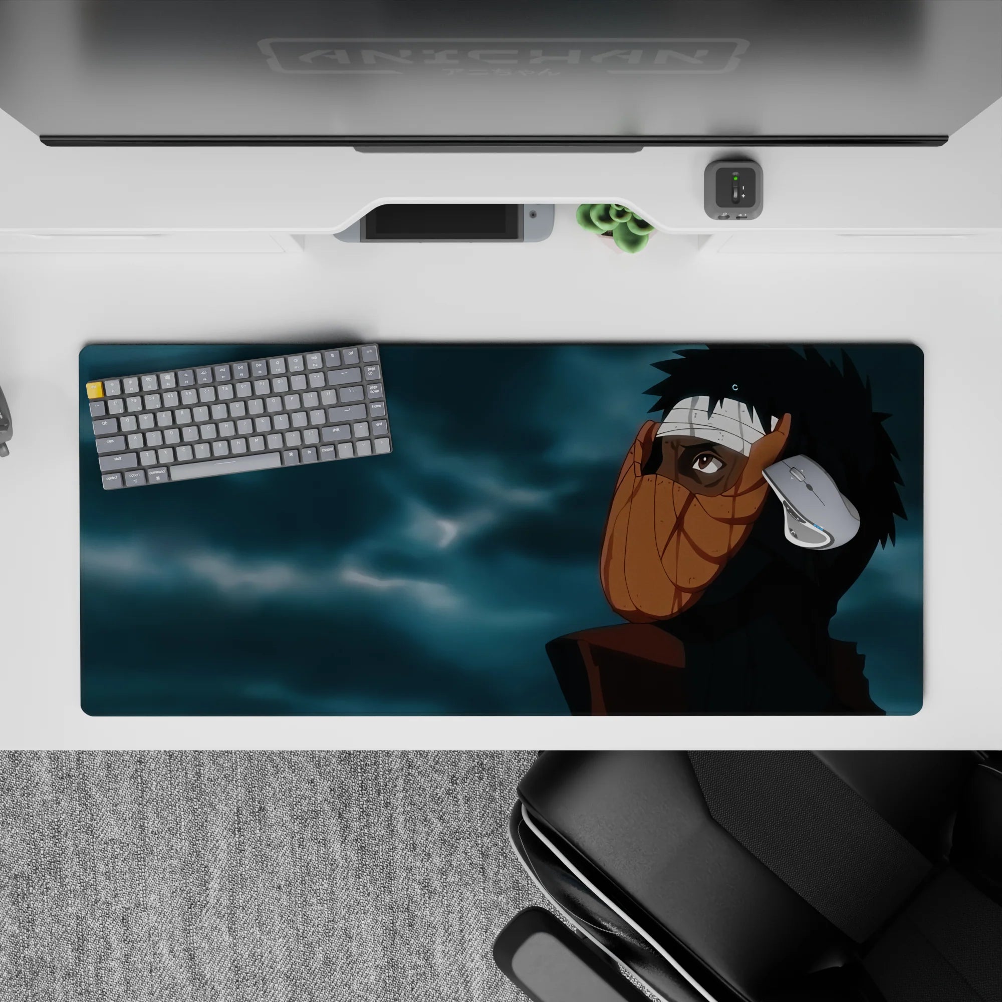 36x16 inches extended mouse pad in dark, moody blues and sharp blacks with warm orange mask tones.