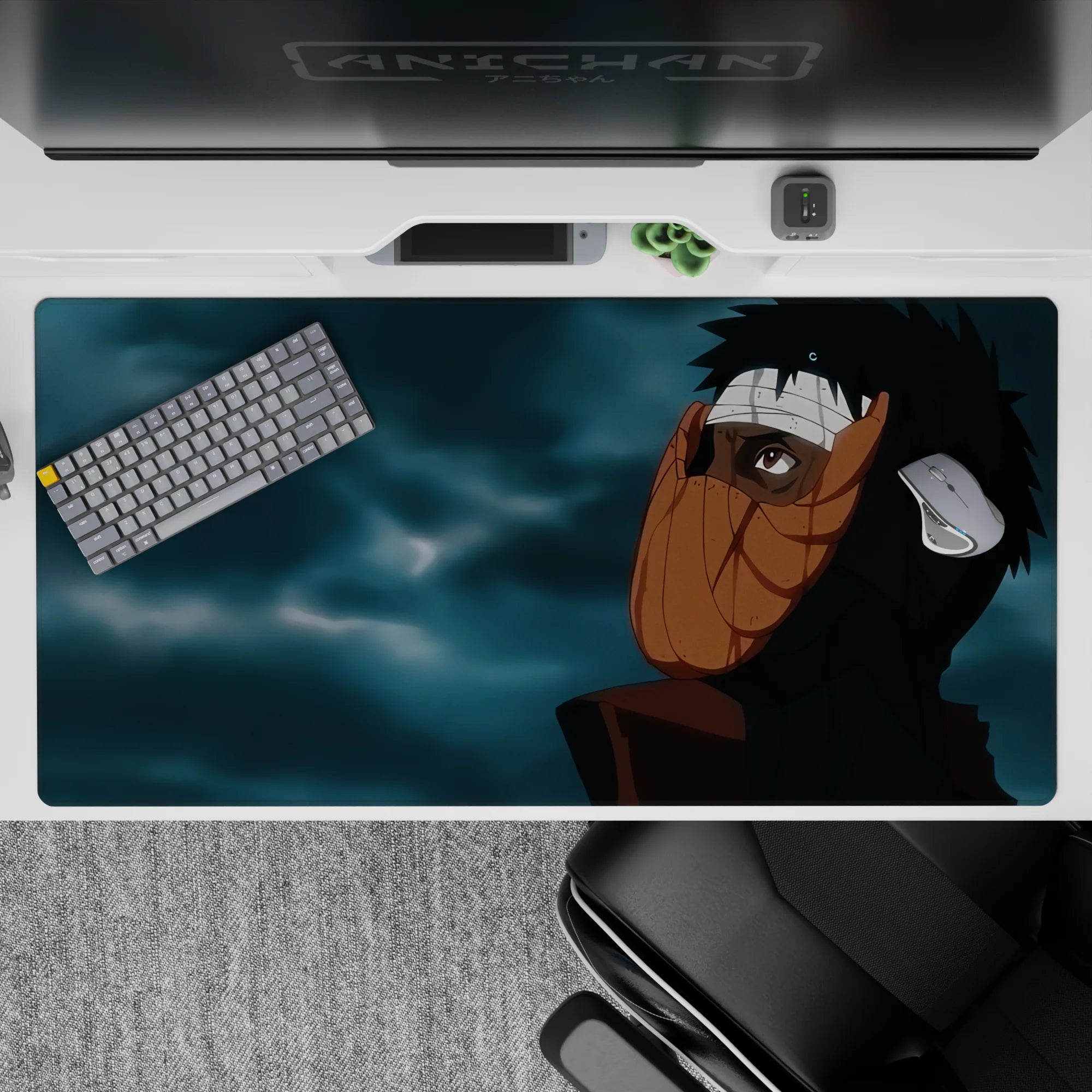 40x20 inches anime desk pad in dark blacks, warm orange mask tones, and moody blue-gray clouds.