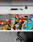 Red, orange, and sky-blue anime desk pad 36x16 inches with chaotic Dreamland vibe, tough-to-playful.