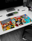 Spiky red-haired hero pointing on anime desk pad 36x16 inches with pink-haired fighter and silver warrior.