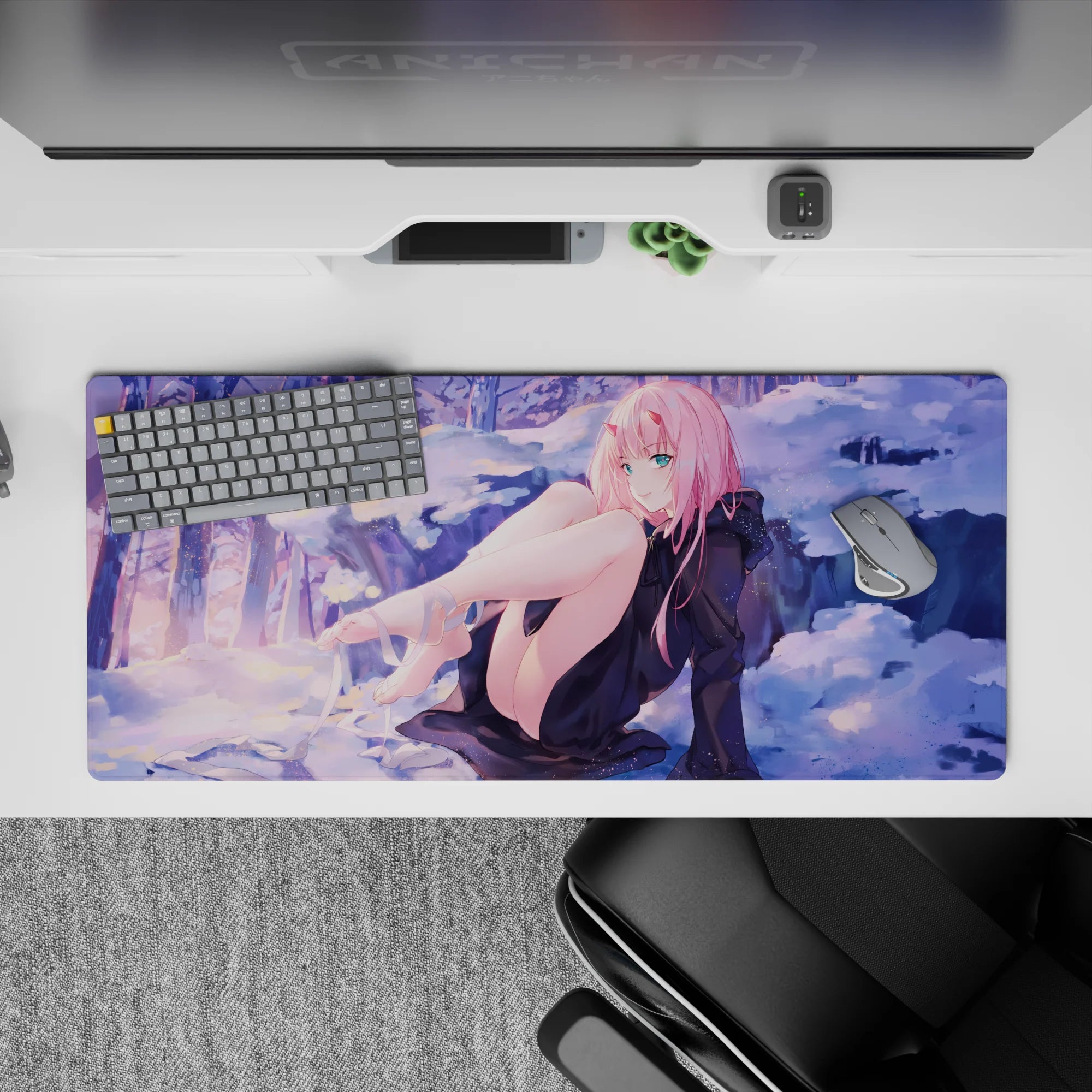 Winter dreamscape 36x16 desk pad featuring Zero Two against a serene snowy backdrop, blending soft purples and golden sunset hues for an elegant contrast