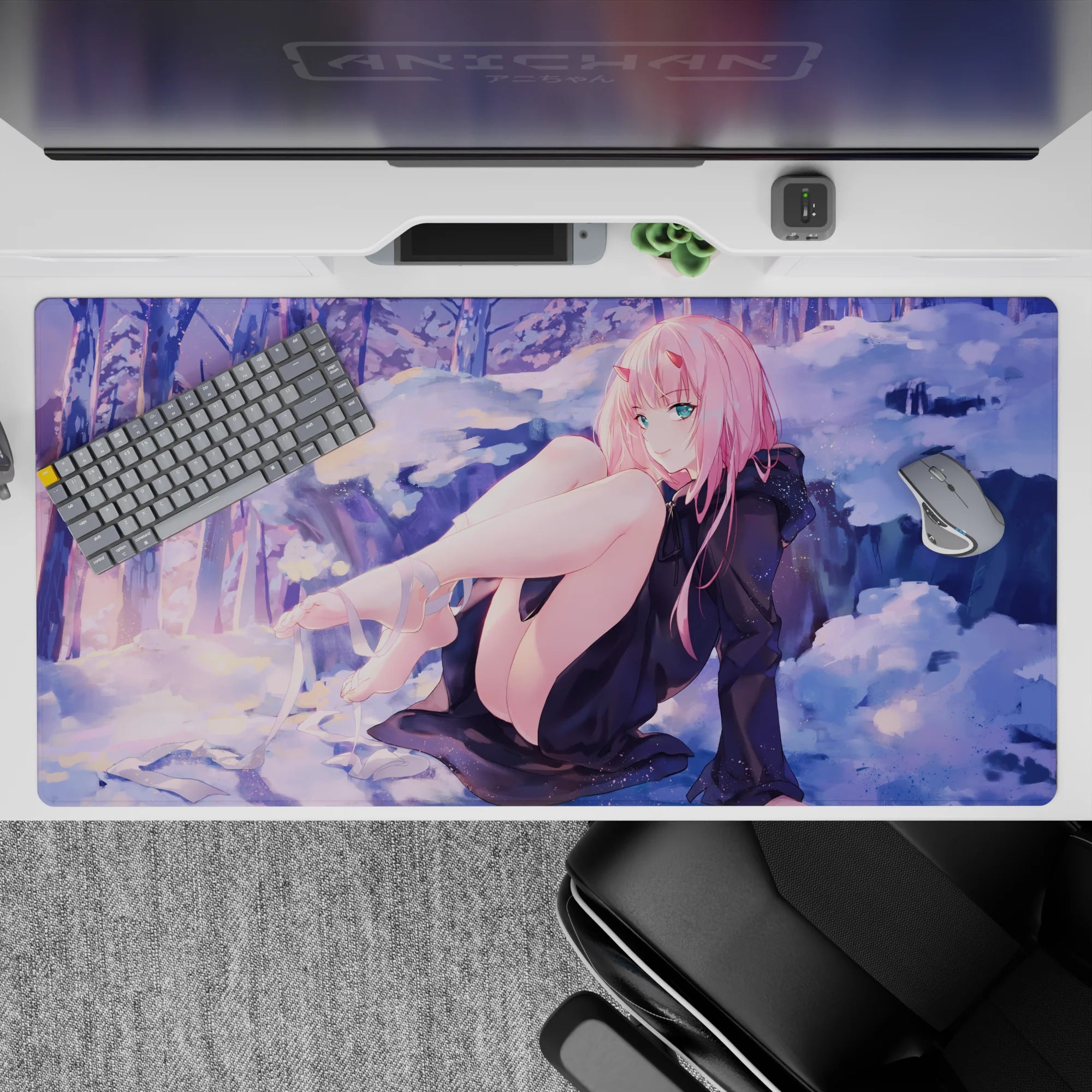 Winter dreamscape 40x20 desk pad with Zero Two in a serene snowy setting, where soft purples and a golden sunset create a mesmerizing contrast