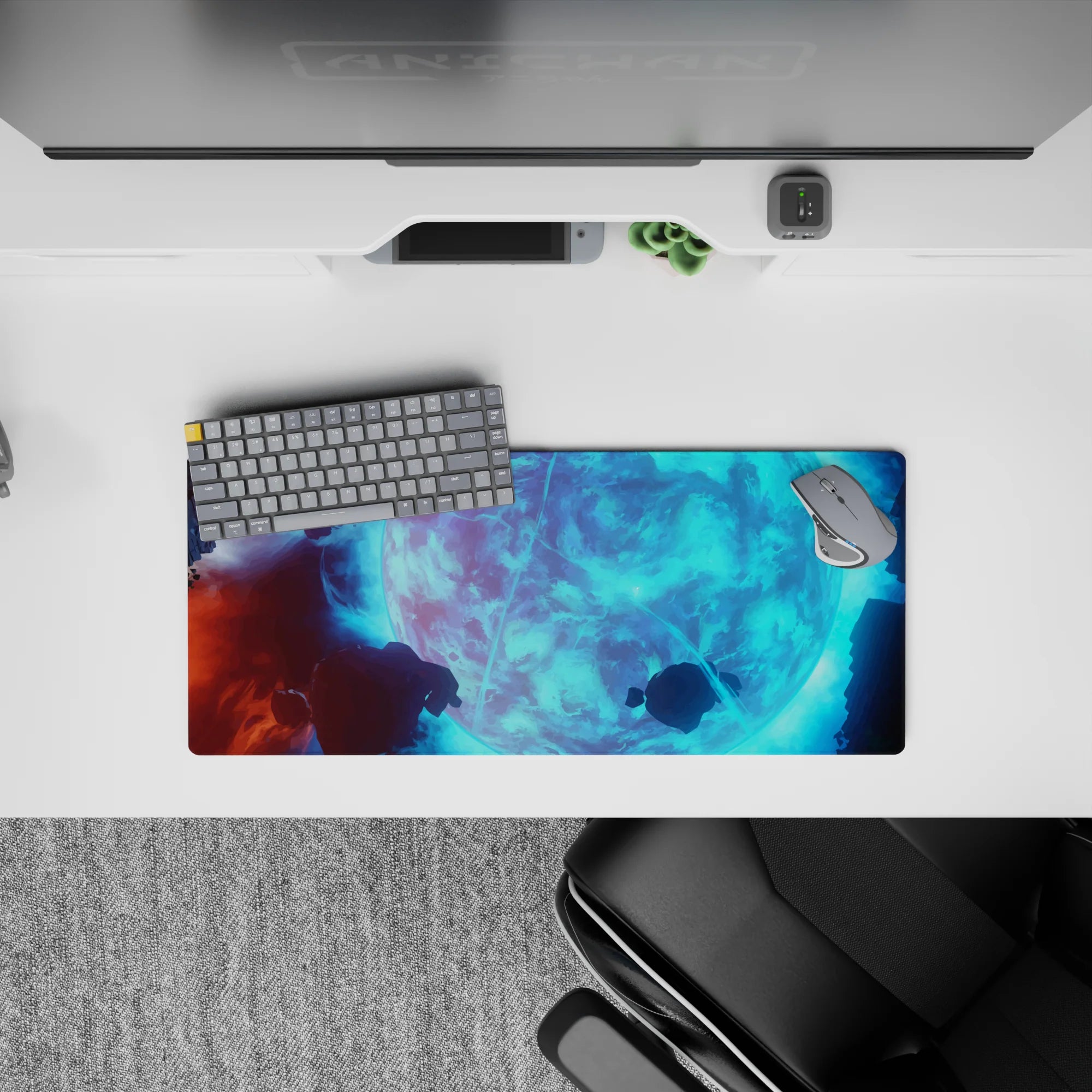 Cool aqua glow cosmic desk mat with deep shadows and floating rocks, 28x12 inches.