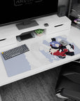 Konan mid-spin tossing white paper shards, Akatsuki cloak, anime desk pad 36x16 inches.