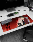 36x16 inches anime desk pad showing pink-haired girl in black dress leaning on boy with flip phone.