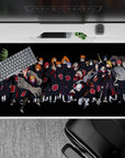 Dark anime desk pad 40x20 inches with deep blacks and candy-red Akatsuki clouds, sinister fun mood.