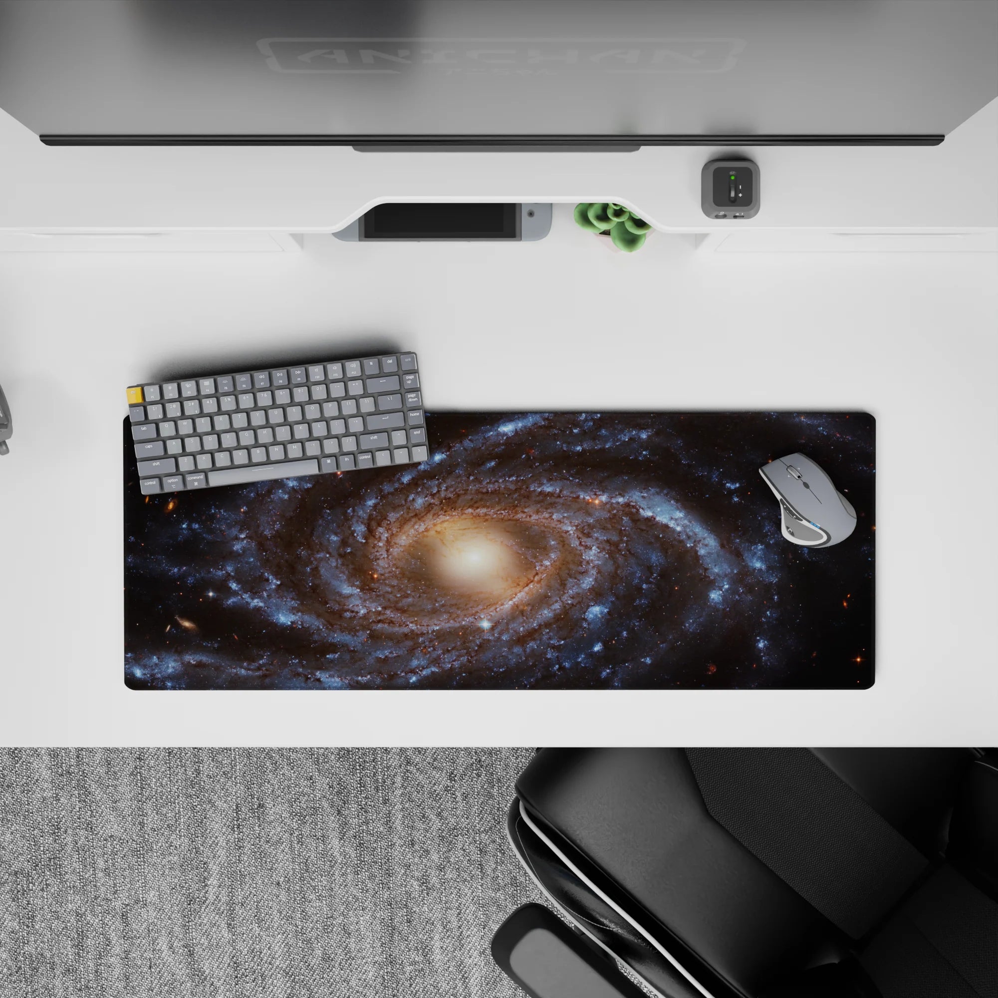 Galaxy themed desk mouse pad with smooth surface and cosmic swirl design, size 32x12 inches.