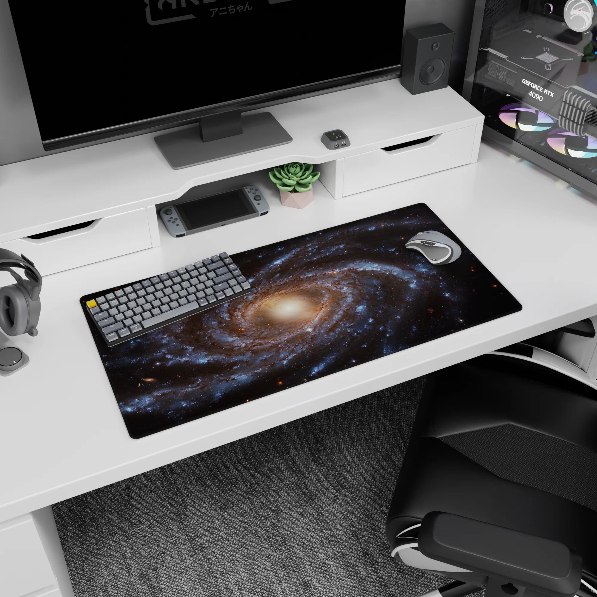 Large 32x16 inch desk mouse pad featuring a calming spiral galaxy design with smoky blues and golden tones.