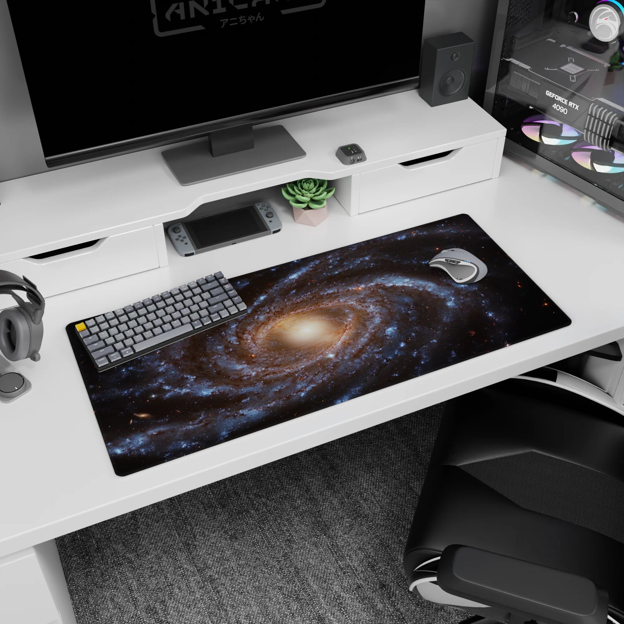 Spiral galaxy desk pad 36x16 inches with swirling blue, gold, and black cosmic design for a calming workspace.