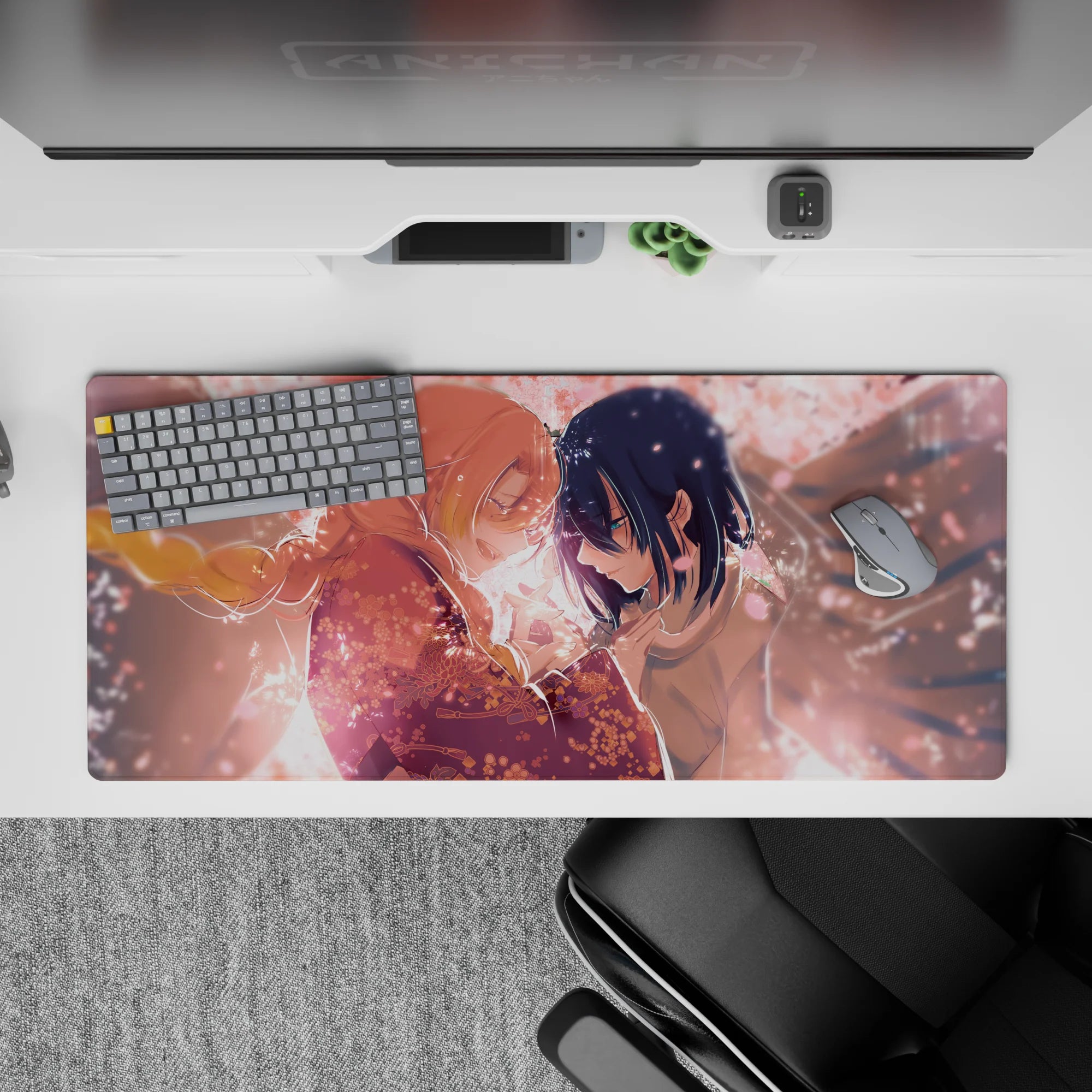 Anime desk pad 36x16 inches with blush-pink petals, intricate kimono patterns, and sakura lights on a peach-hued sky.
