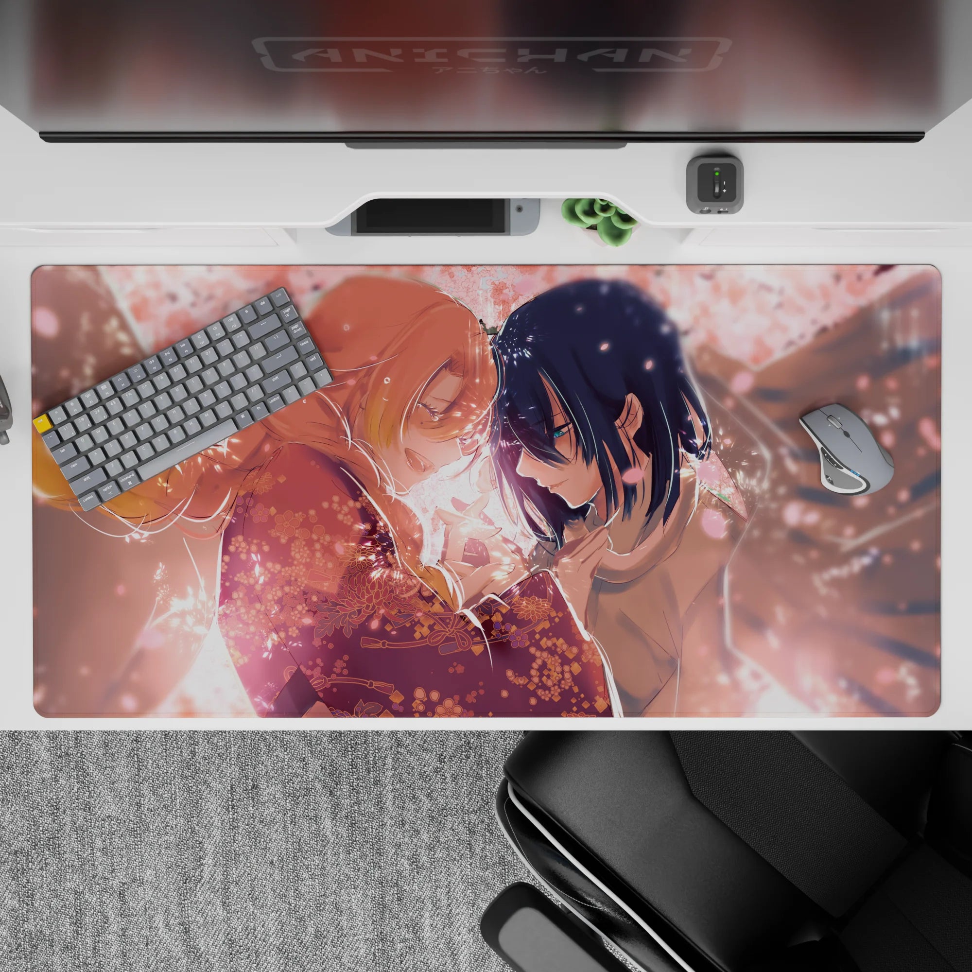 40x20 inch anime mouse pad with blush-pink petals, kimono patterns, and sakura lights against a peach-hued sky.