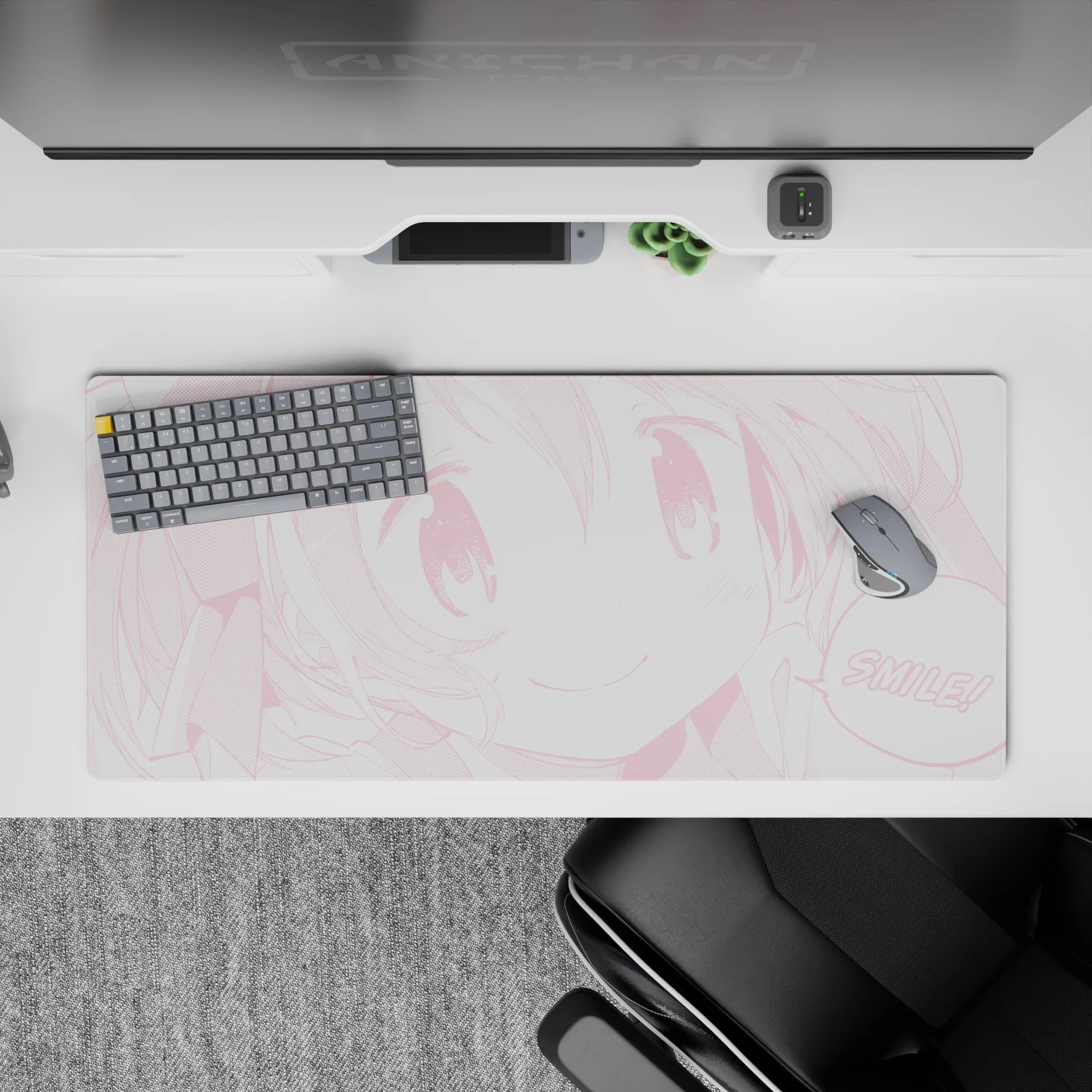 Pastel pink monochrome anime desk pad 36x16 inches, bubbly cute vibe with blush dots and cheerful smile.