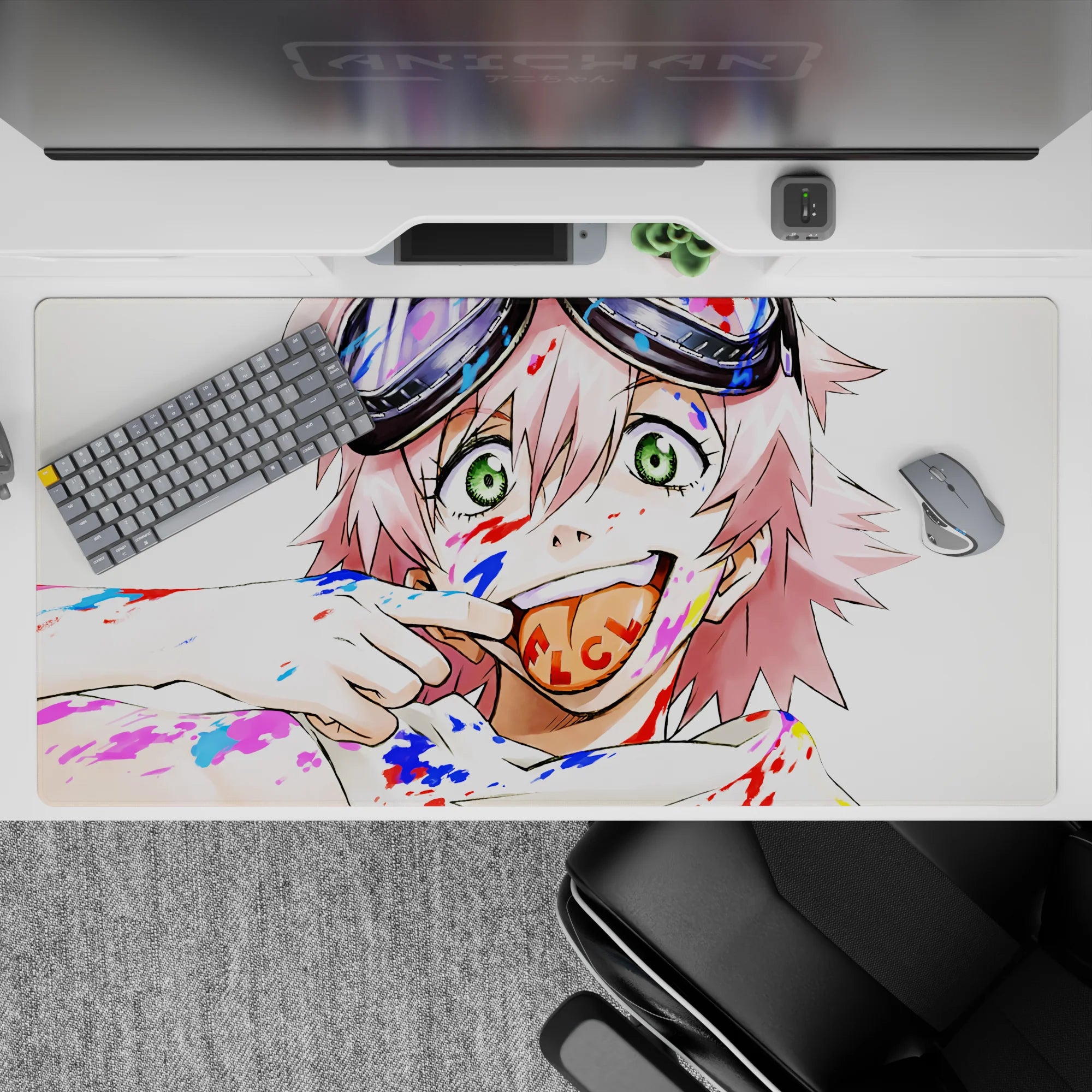 Colorful 40x20 inches anime desk pad in candy reds and electric blues, chaotic cute vibe with bold brushstrokes.