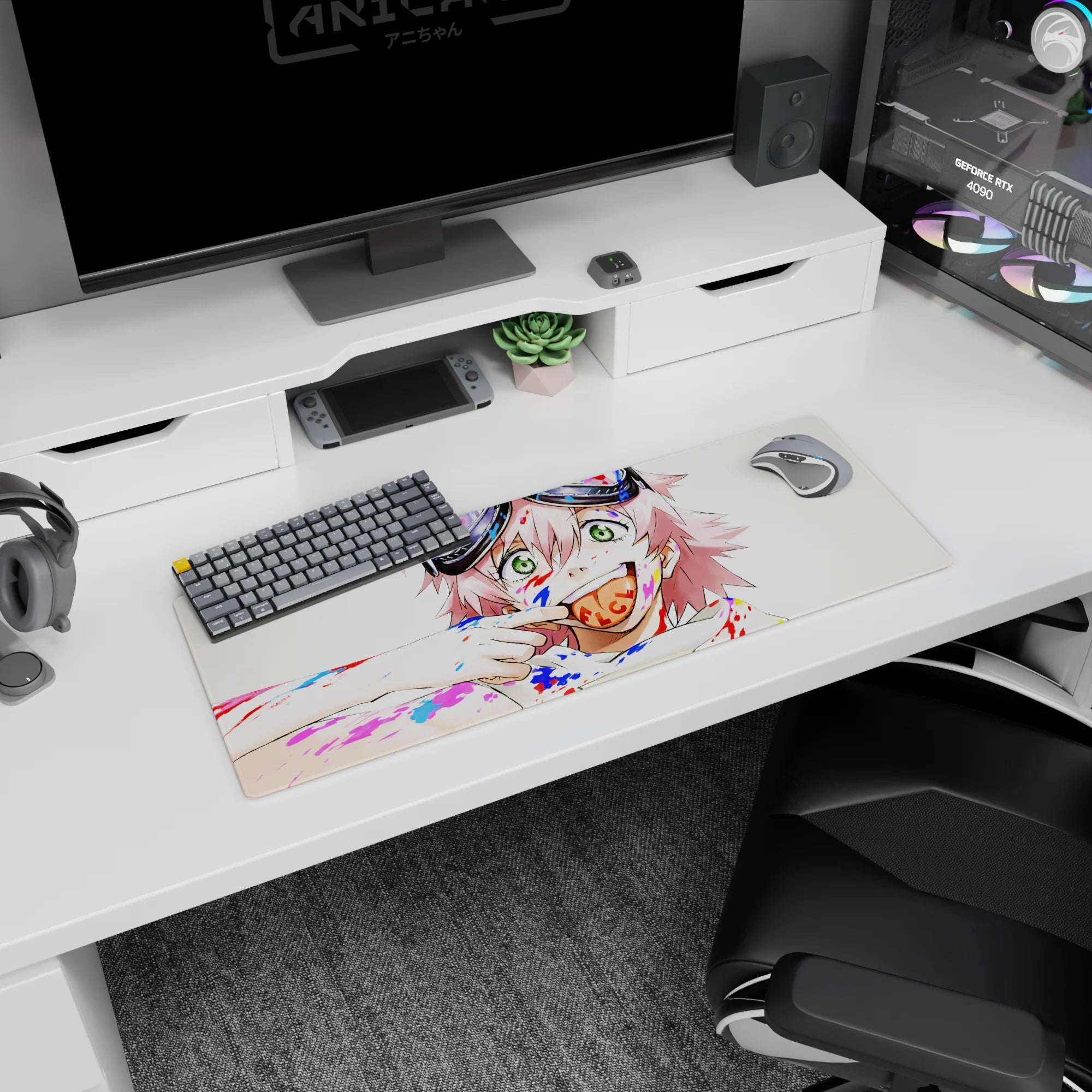 32x12 inches desk mat featuring a grinning pink-haired anime girl with goggles and a lollipop amid paint.