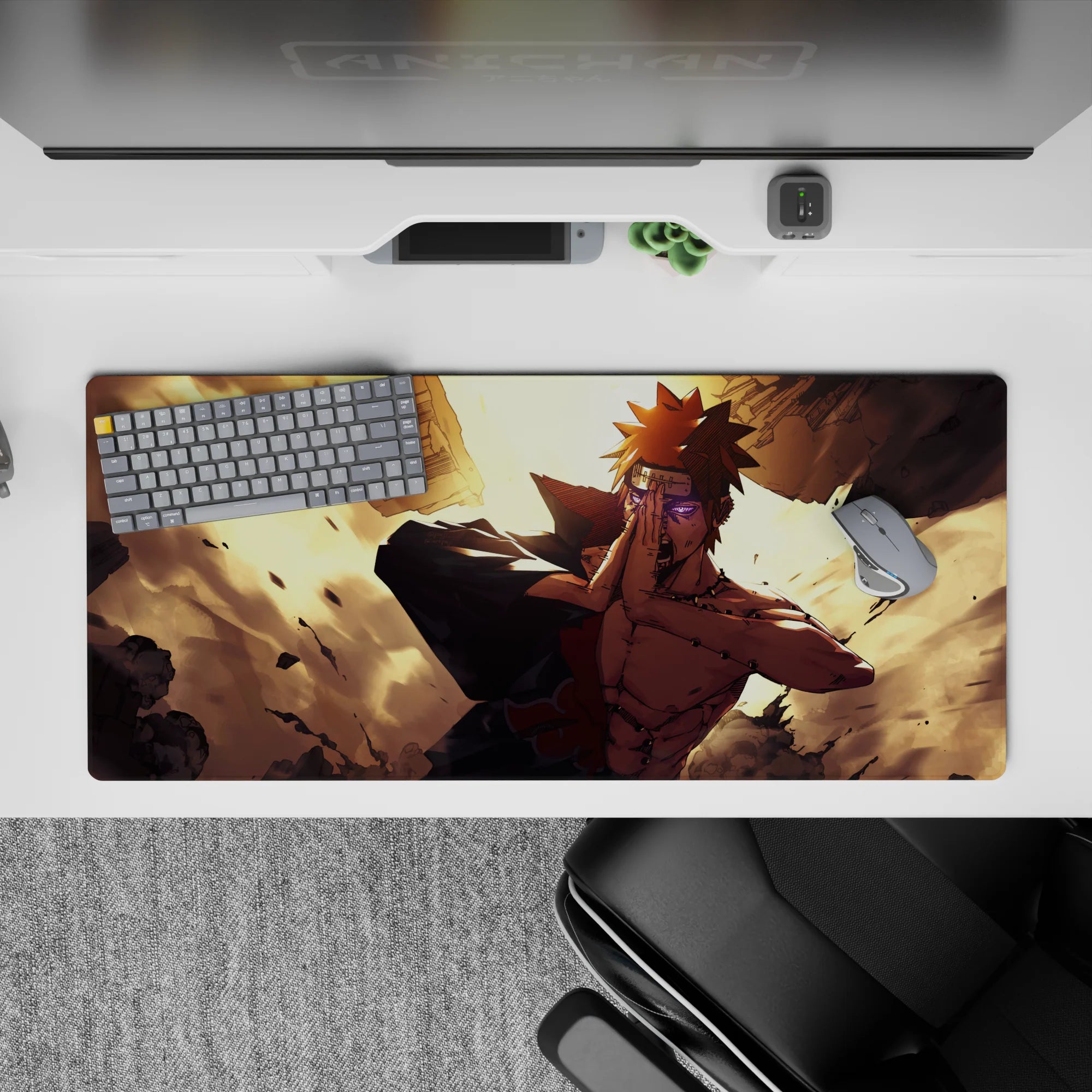 36x16 inches anime desk pad in warm gold light with bold contrast, flying debris, and chaotic energy.