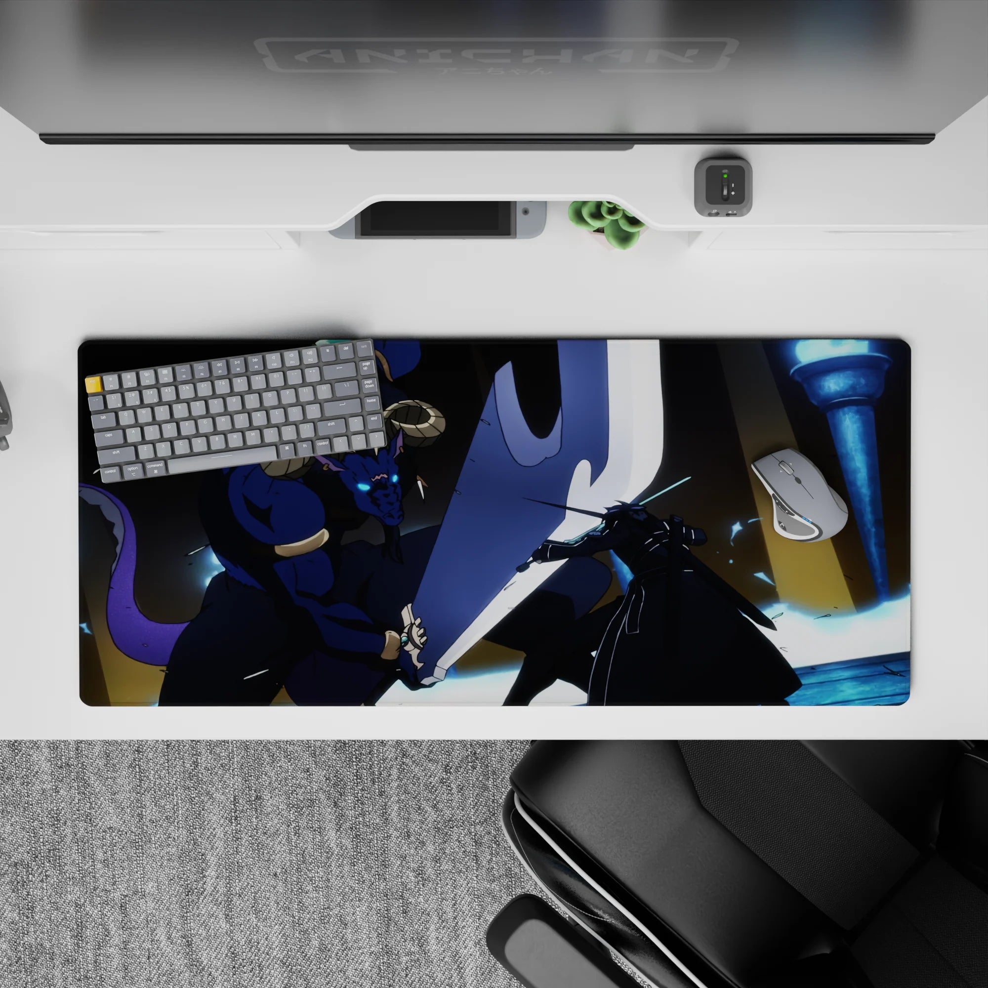 Anime desk pad 36x16 inches featuring Kirito's intense battle with Minotaur boss; vivid blues and indigos dominate.