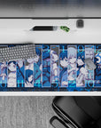 36x16 inches blue-toned anime desk pad with icy contrast, tense mood, and crisp character panels.