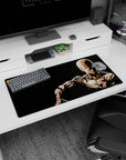 32x16 inches Saitama mouse pad showing the bald hero seated in silence, hand on shoulder, focused gaze.
