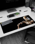 Saitama sitting in silence, hand on shoulder, on an anime desk pad 36x16 inches with sharp shadows.