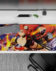 Crimson and gold anime girl desk pad 36x16 inches, neon flame arcs and glossy highlights for a bold mood.