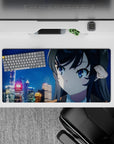 32x16 inches anime desk mat in neon blues and soft golds, cozy winter-night mood with drifting snow.