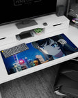 36x16 inches desk pad showing blue-eyed anime girl gazing over a snowy city night, flakes falling like confetti.