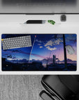 32x16 inches anime mouse pad in cobalt-to-peach sunset gradients, calm cinematic skyline mood.